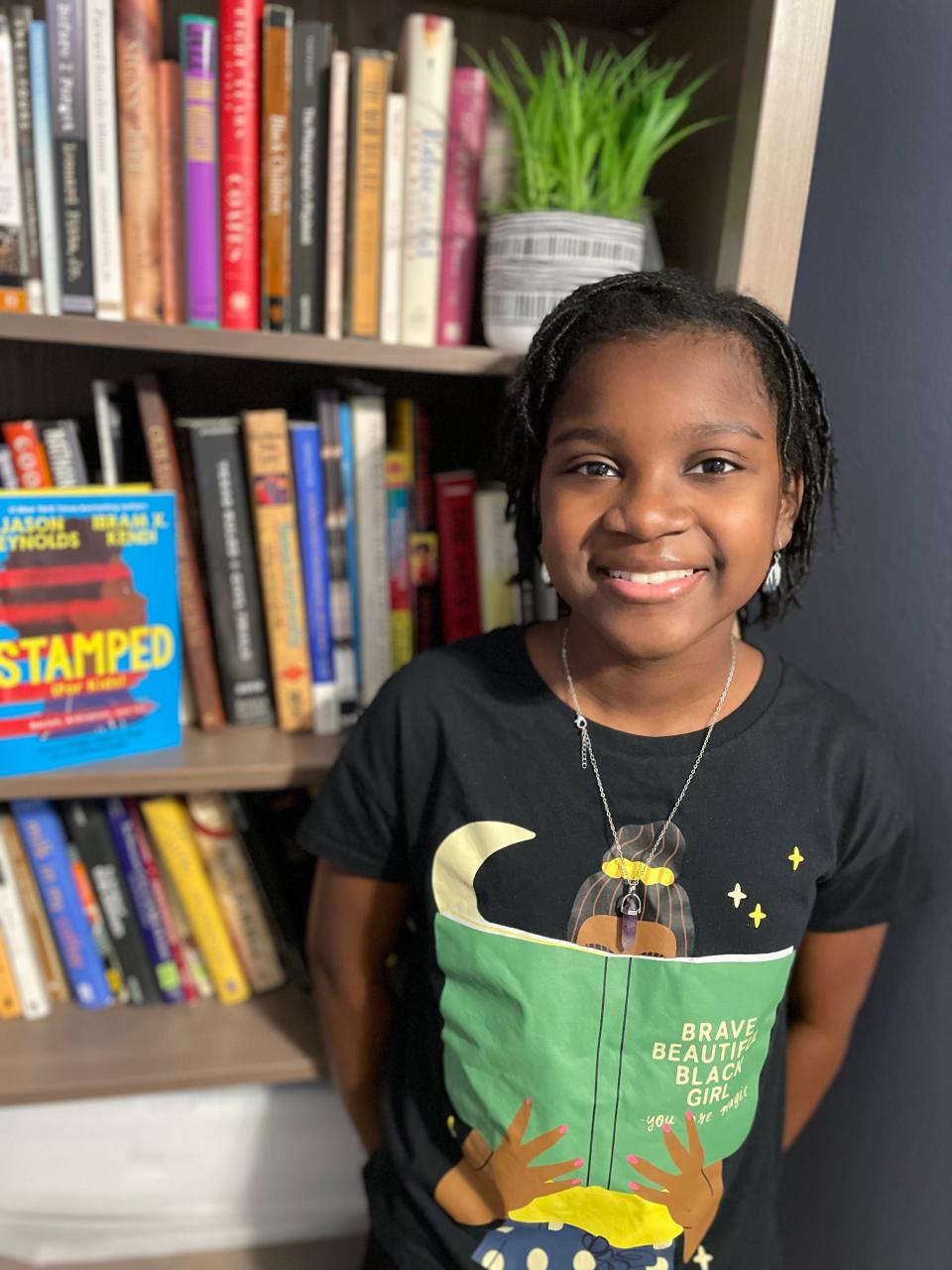 Kharia Pitts, 12, says banning books is pointless because kids are going to find a way to read those titles regardless. She and her friend Jaiden started a book club where they discuss Black literature with their peers.