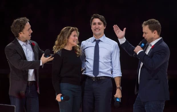 Trudeau and his wife, Sophie Grégoire-Trudeau, are flanked by WE Charity co-founders Craig Kielburger, left, and his brother, Marc, at WE Day celebrations in Ottawa in 2015.