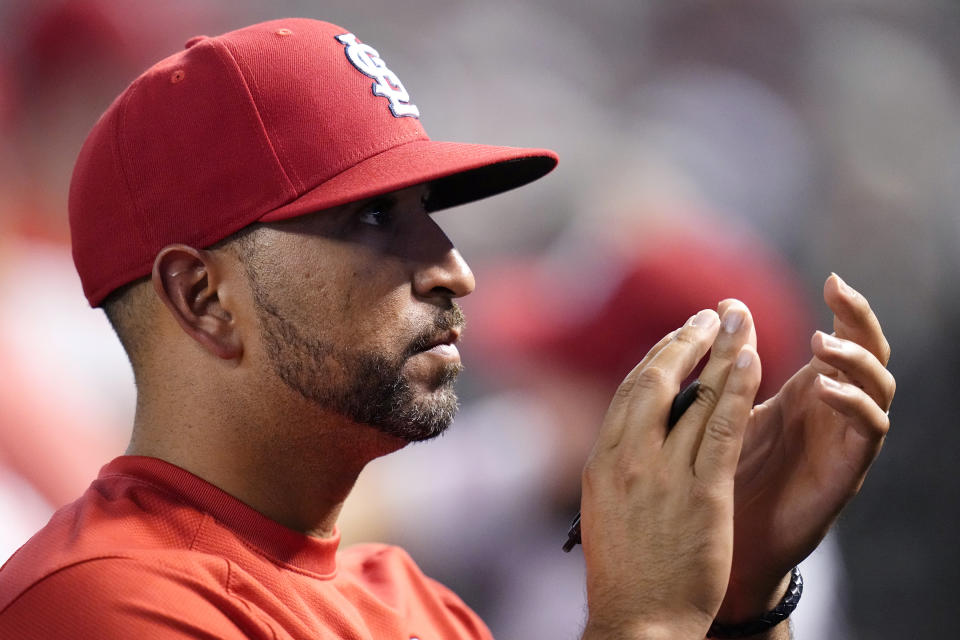 St. Louis Cardinals manager Oliver Marmol applauds as the Arizona Diamondbacks honor veterans during the fourth inning of a baseball game Monday, July 24, 2023, in Phoenix. (AP Photo/Ross D. Franklin)