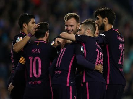 Soccer Football - Espanyol v Barcelona - Spanish La Liga Santander - RCDE stadium, in Cornella-El Prat (Barcelona), Spain - 29/04/2017. Barcelona's players celebrate a goal. REUTERS/Albert Gea