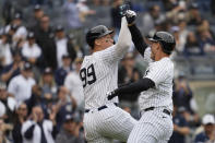 New York Yankees' Anthony Rizzo celebrates with Aaron Judge (99) after hitting a three-run home run in the third inning of a baseball game against the Detroit Tigers, Saturday, May 4, 2024, in New York. (AP Photo/Mary Altaffer)