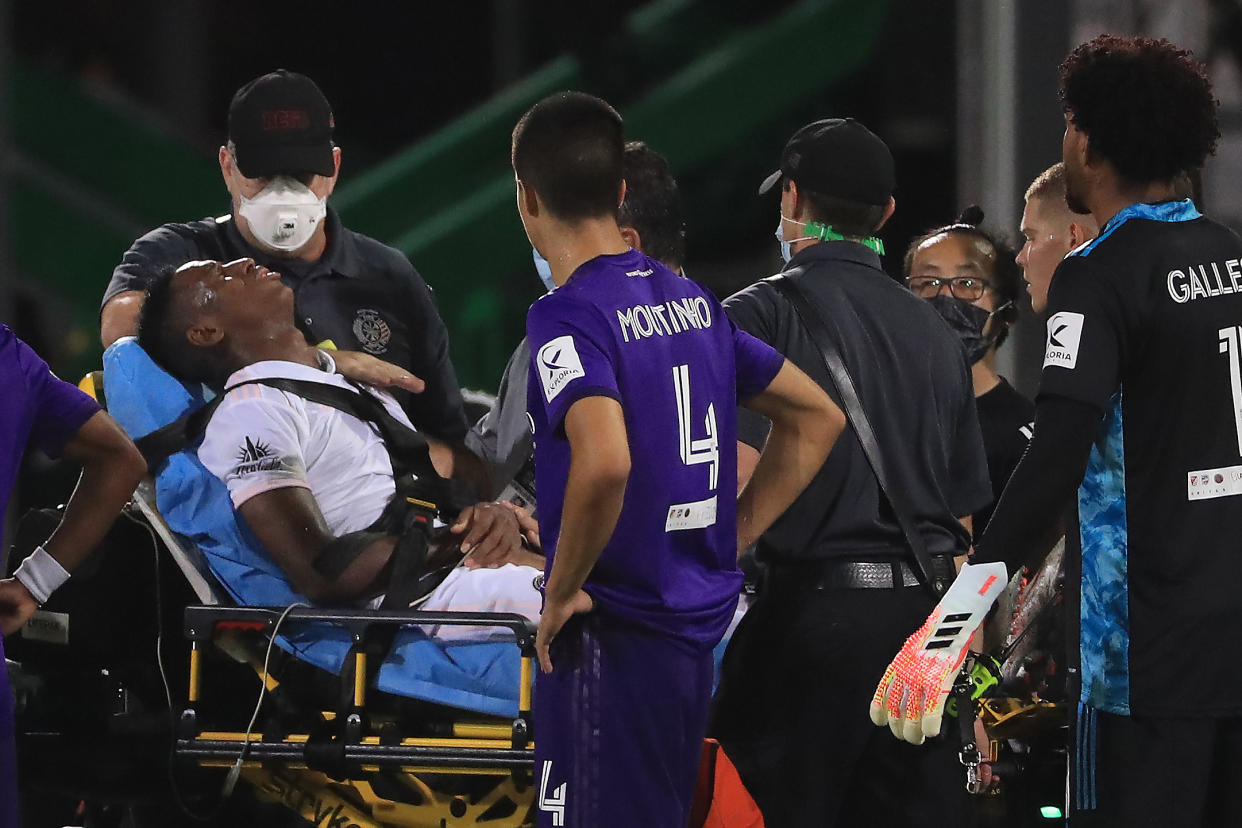 REUNION, FLORIDA - JULY 08: Andres Reyes #3 of Inter Miami is carried off the field after receiving a foul during a match between Orlando City and Inter Miami as part of MLS is back Tournament at ESPN Wide World of Sports Complex on July 08, 2020 in Reunion, Florida. (Photo by Mike Ehrmann/Getty Images)