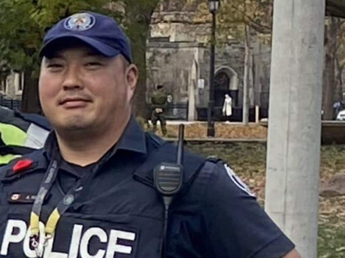 Const. Andrew Hong, 48, a member of the Toronto Police Service's traffic services unit, was fatally shot in Mississauga while on a joint training exercise with Peel and York Regional Police. He died at the scene. (Submitted by name withheld - image credit)