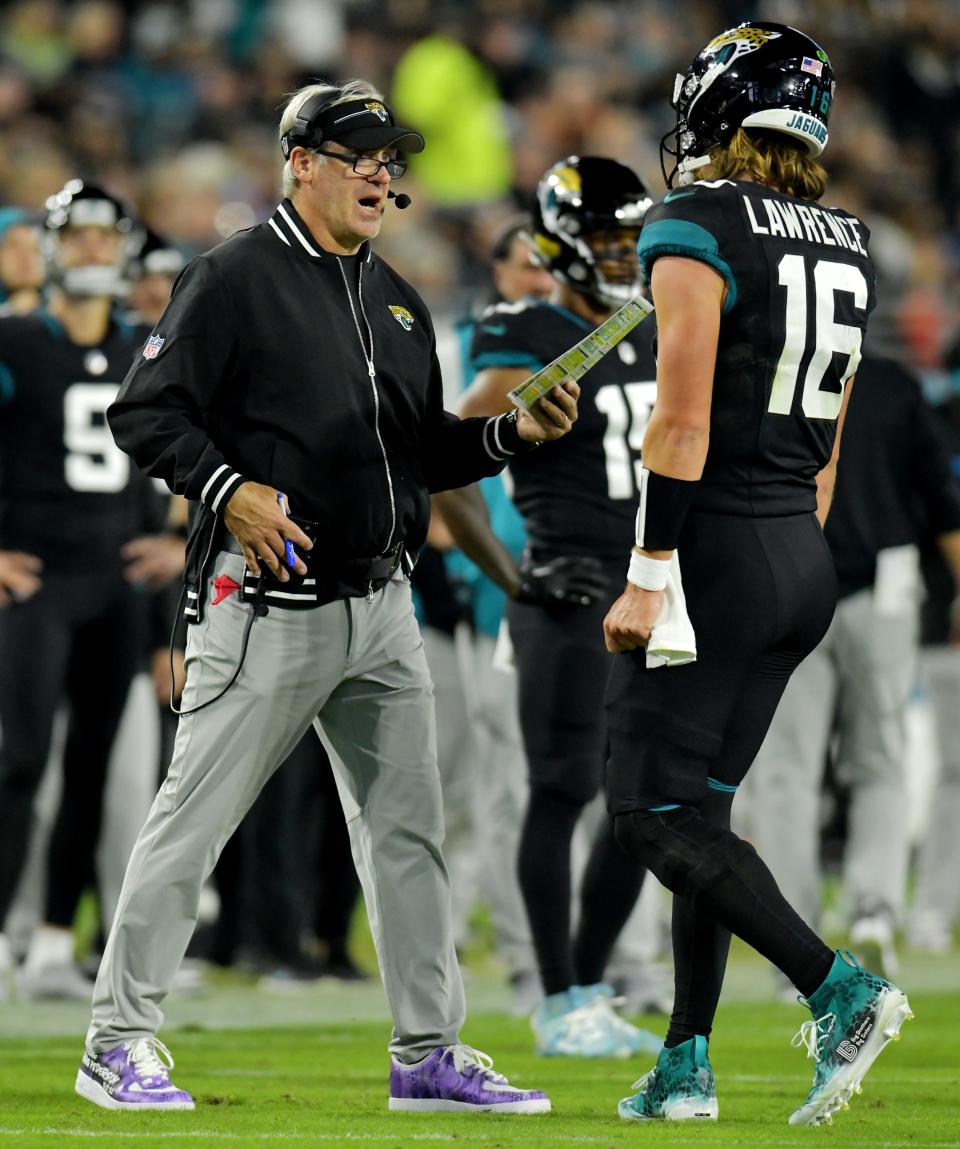 Jacksonville Jaguars head coach Doug Pederson talks as Jacksonville Jaguars quarterback Trevor Lawrence (16) heads to the sideline late in the third quarter. The Jacksonville Jaguars hosted the Cincinnati Bengals at EverBank Stadium in Jacksonville, Florida for Monday Night Football, December 4, 2023. The Jaguars were tied 14 to 14 at the end of the first half an fell in overtime with a final score of 34 to 31. [Bob Self/Florida Times-Union]