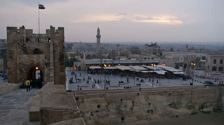 People walk outside restaurants as seen from Aleppo's historic citadel, Syria December 11, 2009. REUTERS/Khalil Ashawi