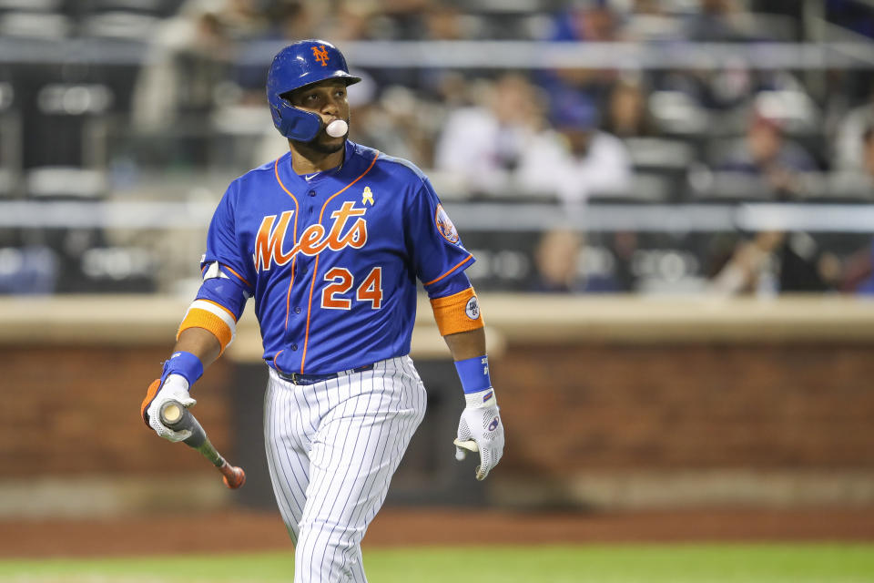 New York Mets' pinch hitter Robinson Cano walks off the field after striking out during the ninth inning of a baseball game against the Philadelphia Phillies, Saturday, Sept. 7, 2019, in New York. (AP Photo/Mary Altaffer)