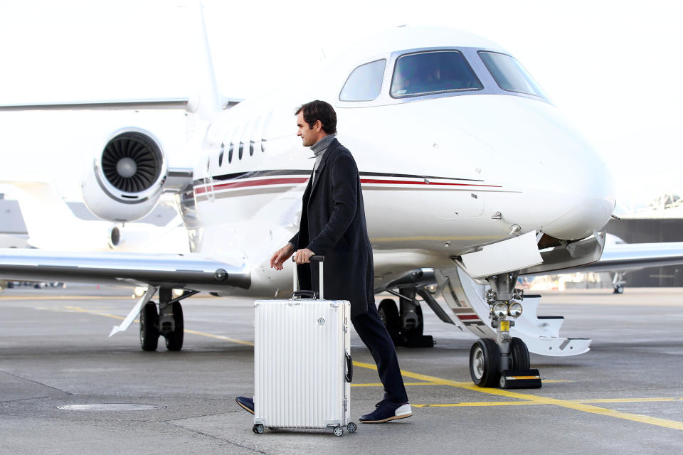 GENEVA, SWITZERLAND - FEBRUARY 08: Roger Federer of Switzerland walks past the Netjets plane as he arrives ahead of the The Laver Cup Press Conference on February 08, 2019 in Geneva, Switzerland. (Photo by Julian Finney/Getty Images for The Laver Cup)