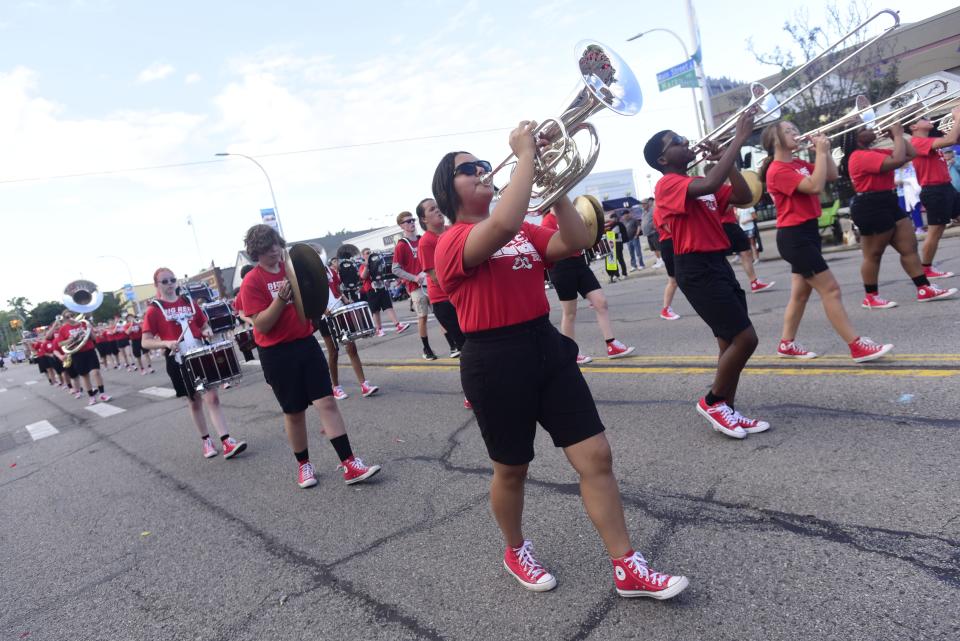 Members of the Port Huron High School Big Red Marching Band perform during the annual Rotary International Day Parade to kick off Port Huron's Boat Week on Wednesday, July 13, 2022.