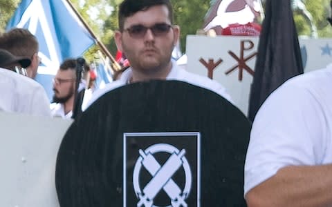 James Alex Fields Jr. is seen participating in Unite The Right rally before his arrest in Charlottesville - Credit: Reuters