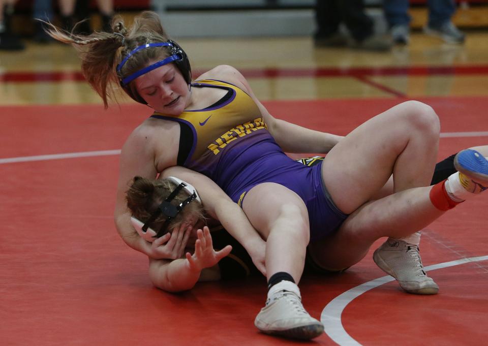 \Nevada Gracie Leslie  goes for pinned West Marshall's Madelynn Grossnick during their 131-pound wrestling in the Ballard Scramble Girls Wrestling at Ballard High School Monday, Jan. 9, 2022, in Huxley, Iowa. Photo by Ames Tribune-USA TODAY Network