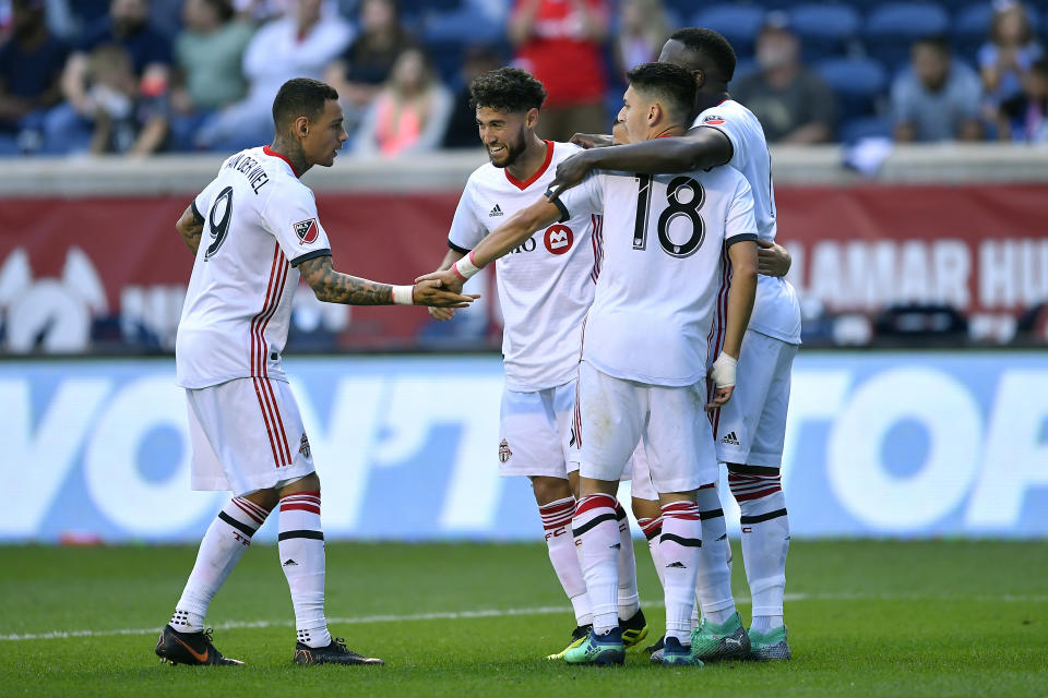 Toronto FC players celebrate Jonathan Osorio’s winning goal against the Chicago Fire on Saturday. (Getty)