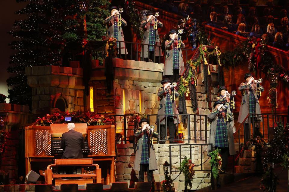 Trumpeters and organist Richard Elliott are shown playing during the 2023 concert “Christmas with the Tabernacle Choir.”