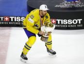 Ice Hockey - 2017 IIHF World Championship - Gold medal game - Sweden v Canada - Cologne, Germany - 21/5/17 - Sweden's Joel Lundqvist holds the trophy REUTERS/Wolfgang Rattay