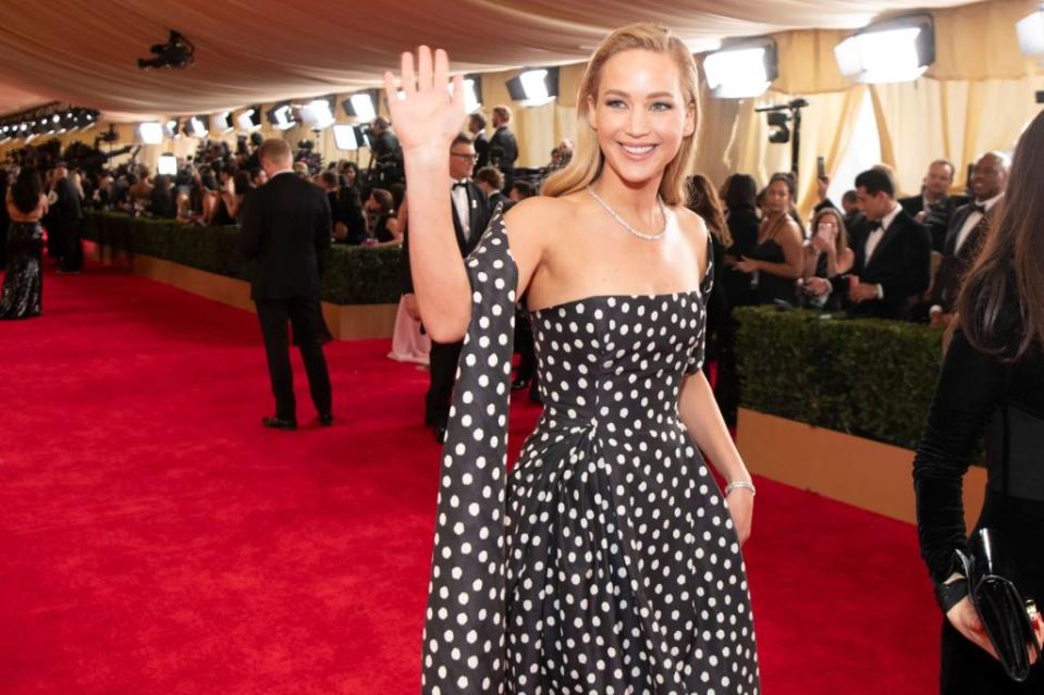 Jennifer Lawrence arrives at the 2024 Oscars. Disney