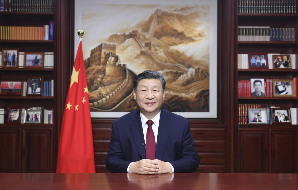 In this photo released on Sunday, Dec. 31, 2023 by Xinhua News Agency, Chinese President Xi Jinping delivers a New Year message in Beijing to ring in 2024. (Ju Peng/Xinhua via AP)