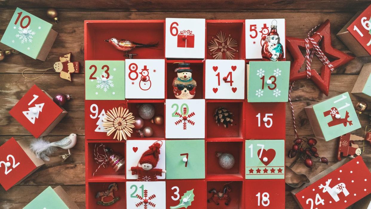 old wooden advent calendar with vintage decorations