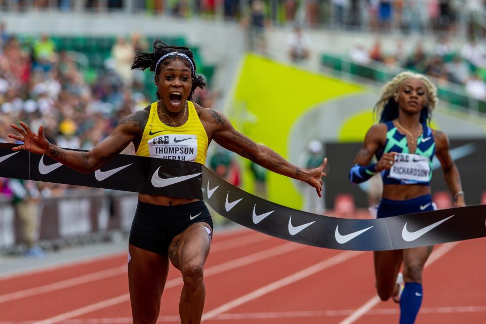 Jamaica’s Elaine Thompson-Herah wins the 100 meters in 10.54 at at the 2021 Prefontaine Classic at Hayward Field in Eugene, Ore., on Saturday, Aug. 21, 2021. USA’s Sha'carri Richardson, right, finished last.