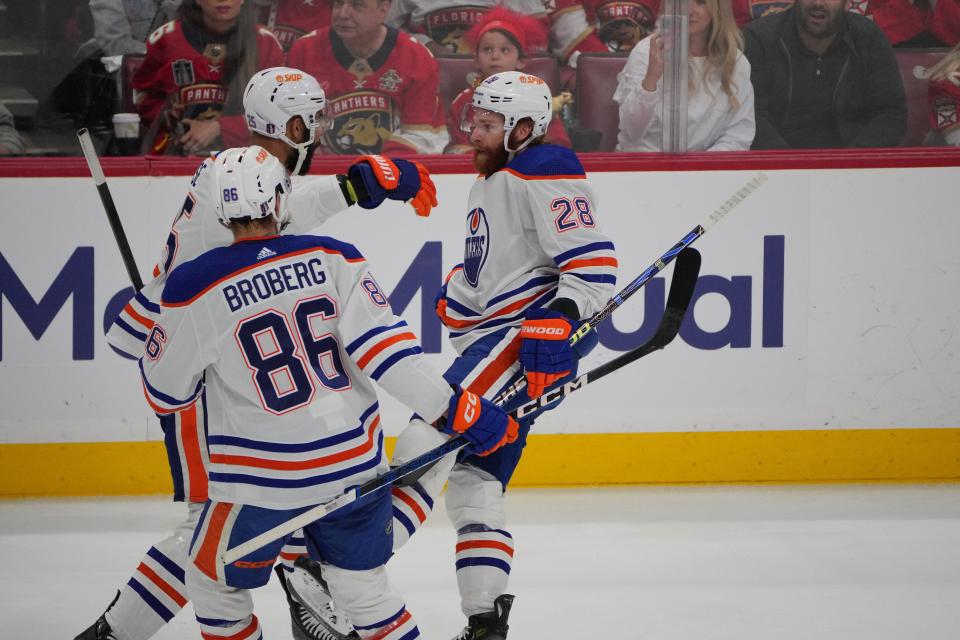 Jun 18, 2024; Sunrise, Florida, USA; Edmonton Oilers forward Connor Brown (28) celebrates scoring a shorthanded goal with defenseman Darnell Nurse (25) and defenseman Philip Broberg (86) against Florida Panthers goaltender Sergei Bobrovsky (72) (not pictured) during the first period in game five of the 2024 Stanley Cup Final at Amerant Bank Arena. Mandatory Credit: Jim Rassol-USA TODAY Sports