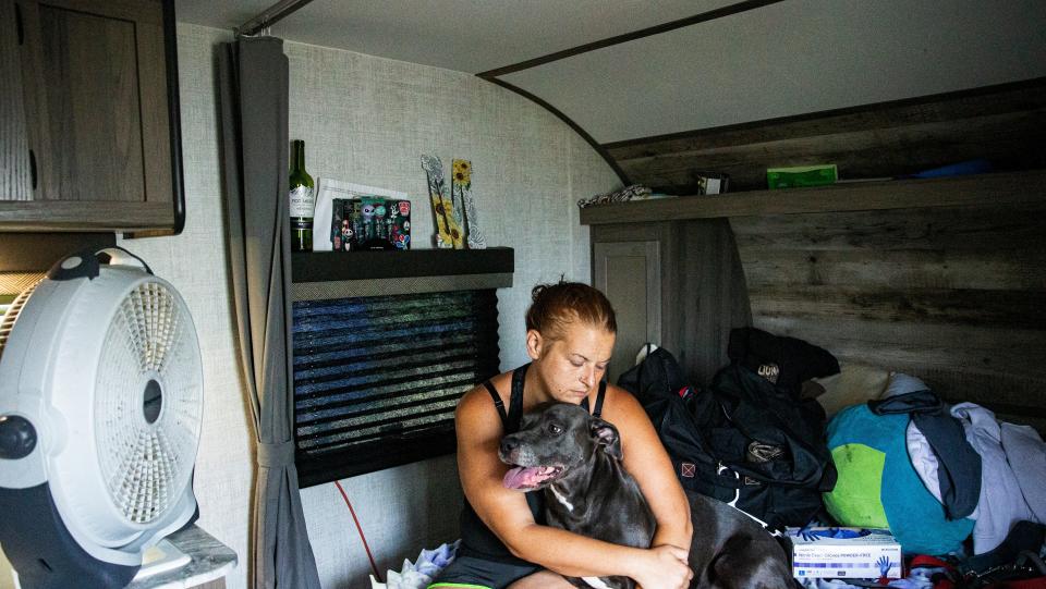 Geri Mendoza prepares to move out of her FEMA trailer at the Palms on Pine Island on July 26. She and her family were moving in with family members. She and her husband decided to leave the small trailer after FEMA wanted to relocate them to another trailer at a different location.