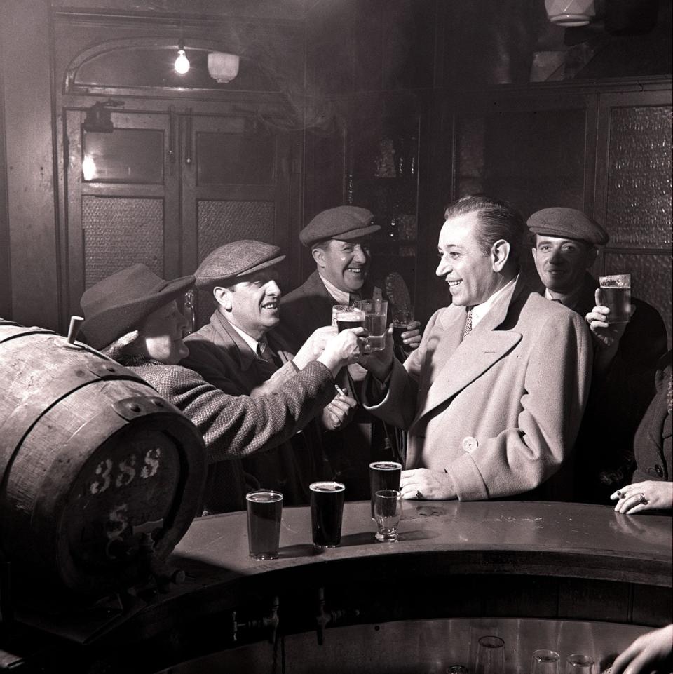 Film star George Raft in a London pub while on a visit to the city in 1947 - Popperfoto via Getty Images/Getty Images