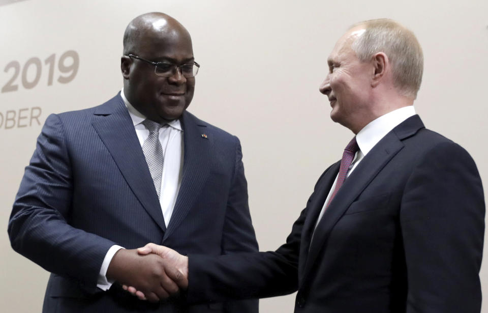 Russian President Vladimir Putin, right, shakes hands with Republic of Congo's President Felix Tshisekedi during their meeting on the sideline of Russia-Africa summit in the Black Sea resort of Sochi, Russia, Wednesday, Oct. 23, 2019. (Mikhail Metzel, TASS News Agency Pool Photo via AP)