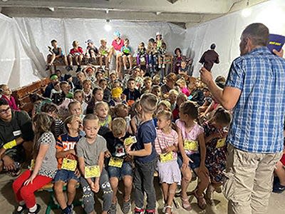 During a vacation Bible school in Ukraine in August, children gather in a bomb shelter prepared in case there were air raid sirens. Jacksonville-based missionary Kathy Gould's nonprofit helped with crafts, object lessons and other activities.