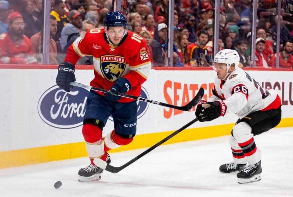 Florida Panthers right wing Vladimir Tarasenko (10) skates with the puck as Ottawa Senators defenseman Erik Brannstrom (26) defends in the second period of their NHL game at Amerant Bank Arena on Tuesday, April 9, 2024, in Sunrise, Fla.