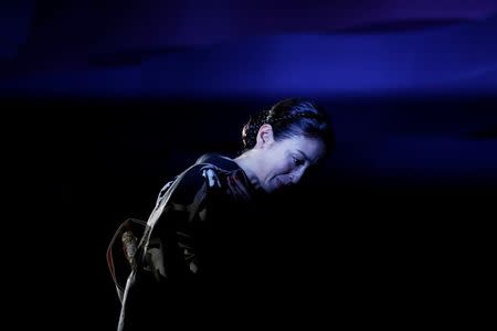 Japanese actress Rie Miyazawa walks towards the stage as she receives the award for best actress for her role in "Pale Moon" during the closing ceremony of the Tokyo International Film Festival in Tokyo October 31, 2014. REUTERS/Yuya Shino