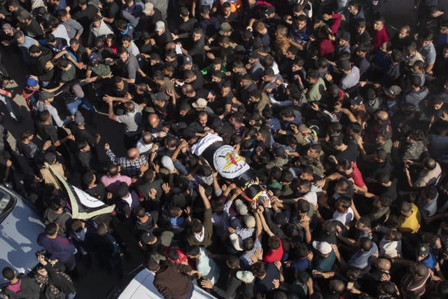 Palestinians carry the body of Bahaa Abu el-Atta