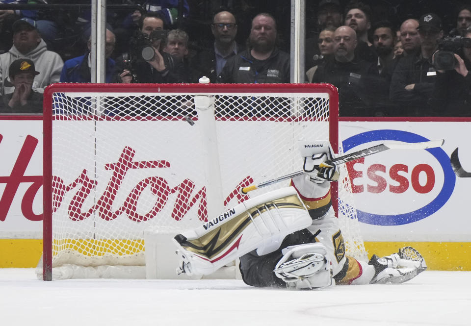 Vegas Golden Knights goalie Jonathan Quick gives up a goal to Vancouver Canucks' J.T. Miller on a penalty shot during the second period of an NHL hockey game Tuesday, March 21, 2023, in Vancouver, British Columbia. (Darryl Dyck/The Canadian Press via AP)