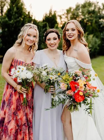 <p>Kindle & Grain Photography</p> Sierra O'Connell and her bridesmaids in their mismatched dressed