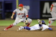Los Angeles Angels second baseman David Fletcher cannot handle the throw as Toronto Blue Jays' Bo Bichette steals second base during the sixth inning of a baseball game Thursday, April 8, 2021, in Dunedin, Fla. (AP Photo/Mike Carlson)