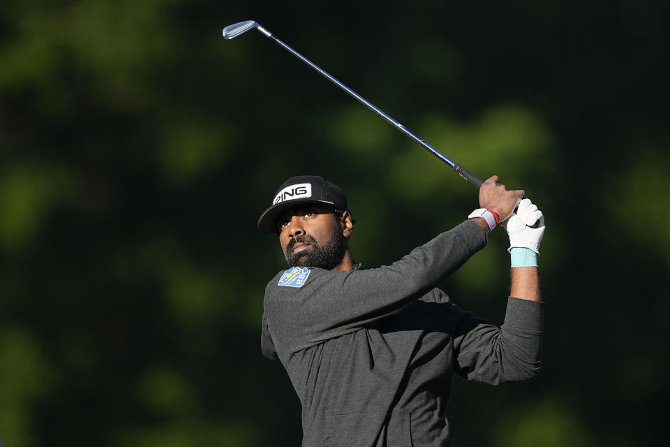 Sahith Theegala watches his tee shot on the 13th hole during first round of the Wells Fargo Championship golf tournament at the Quail Hollow Club on Thursday, May 4, 2023, in Charlotte, N.C. (AP Photo/Chris Carlson)