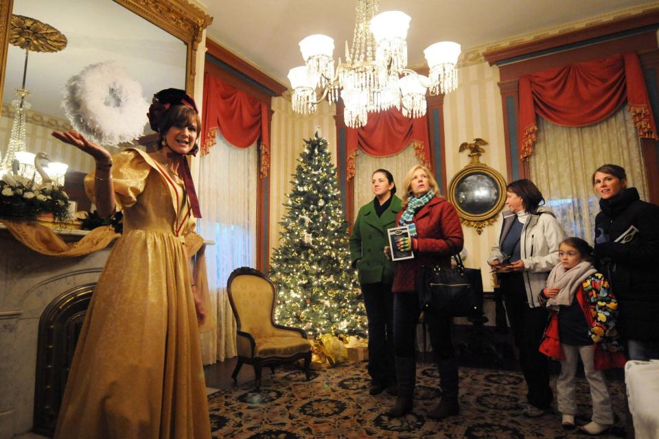 Laura Poteat gives a tour of the Latimer House at 126 S. 3rd St. during the Historical Society of the Lower Cape Fear's Old Wilmington by Candlelight Tour in 2013.