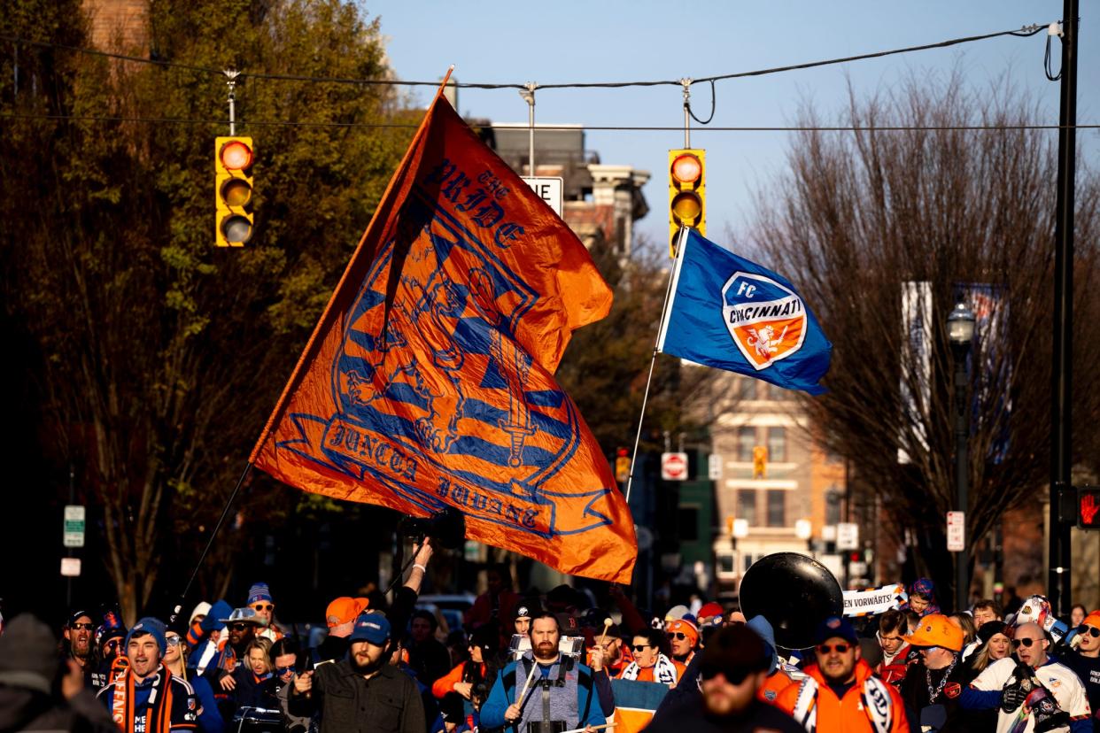 FC Cincinnati fans march to TQL Stadium to get ready for the match.