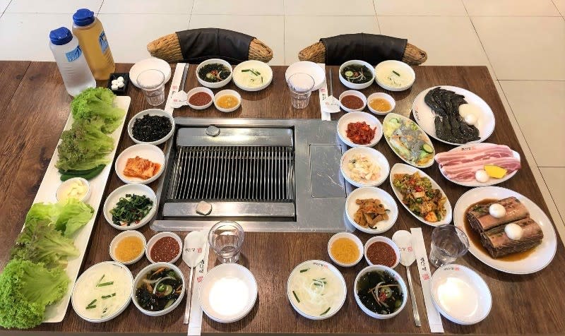 KBBQ - table of dishes for cooking 