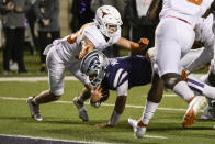 FILE - Kansas State quarterback Adrian Martinez (9) is stopped short of the goal line by Texas defensive back Michael Taaffe (36) during the second half of an NCAA college football game, Nov. 5, 2022, in Manhattan, Kan. Texas is back — fourteen years after last playing for a national championship, Texas (12-1) is in the College Football Playoff as Big 12 champion. (AP Photo/Reed Hoffmann, File)