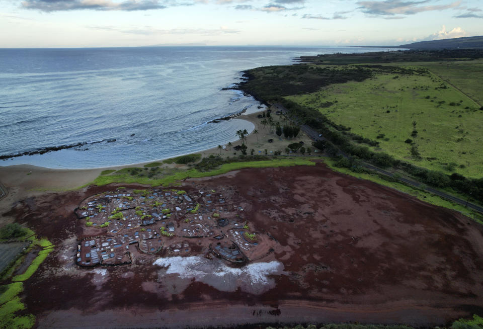 An arial view of the Hanapepe salt patch near Salt Pond Beach Park on Tuesday, July 11, 2023, in Hanapepe, Hawaii. The existence of this salt patch is being threatened by climate change, rising sea levels and pollution. (AP Photo/Jessie Wardarski)