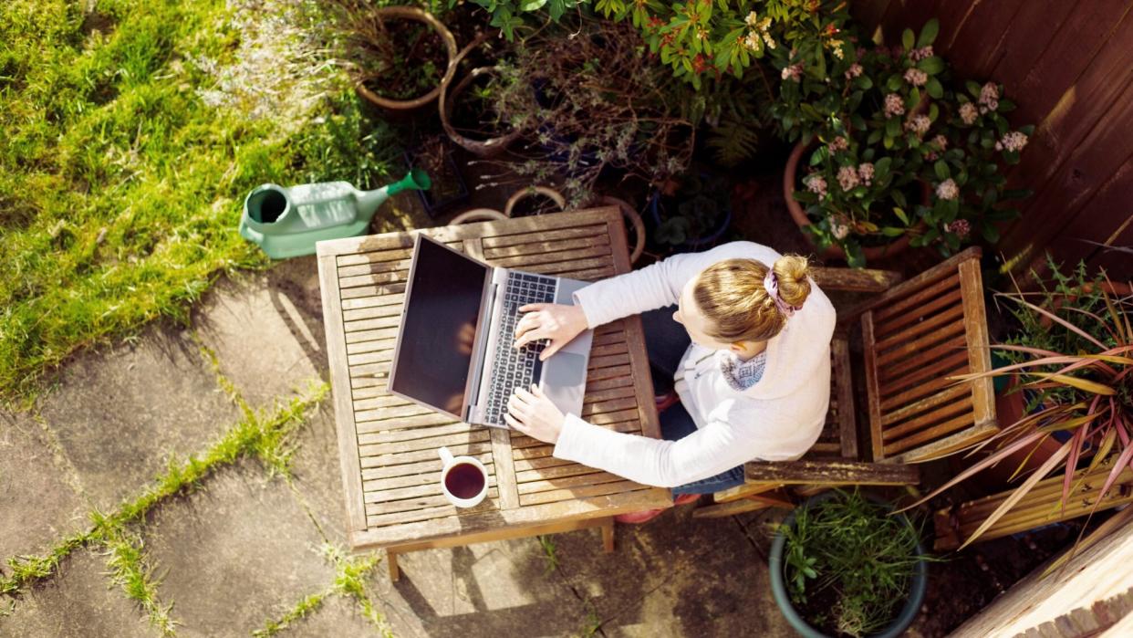 woman sitting and working outside