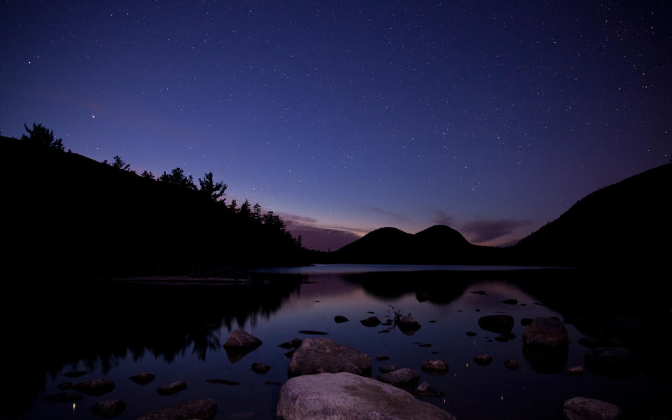 Go kayaking at night at Acadia National Park, Maine, U.S.