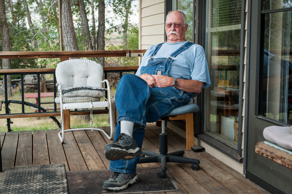 Bill Phillips, 77, on his front porch along the Yellowstone River east of Livingston. Phillips was a machinist for the railroad.