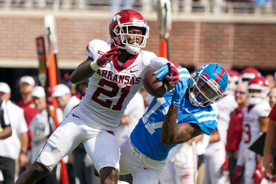 Arkansas defensive back Montaric Brown (21) breaks up a pass intended for Mississippi wide receiver Jadon Jackson (17) during their 2021 game at Vaught-Hemingway Stadium.