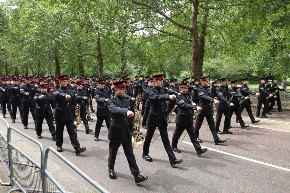 Royal guards march down Birdcage Walk on route to Westminster Abbey, London, ahead of US President Donald Trump on day one of his three day state visit to the UK.