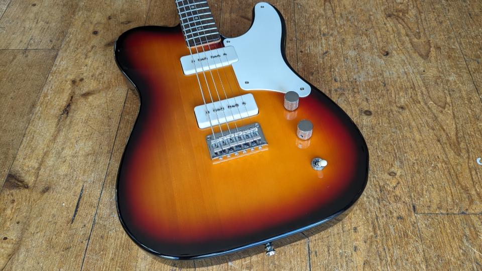 A Squier Paranormal Baritone Cabronita Telecaster on a wooden floor