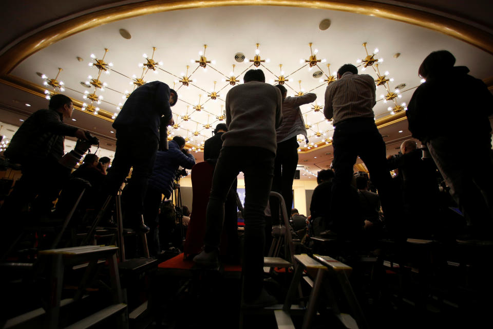 <p>Photographers take pictures during a news conference by Zhou Xiaochuan, governor of the People’s Bank of China, at China’s National People’s Congress (NPC) in Beijing on March 9, 2018. (Photo: Aly Song/Reuters) </p>