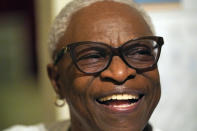 Doris Brown laughs as she answers a question during an interview inside her home Friday, July 31, 2020, in Houston. Brown's home flooded during Harvey and she's part of a group called the Harvey Forgotten Survivors Caucus. (AP Photo/David J. Phillip)