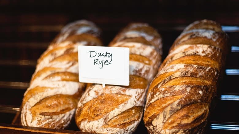 three loaves of rye bread shelved