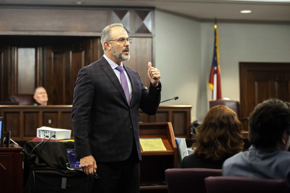 Defense attorney Jason B. Sheffield presents a closing argument to the jury during the trial of Travis McMichael, his father, Gregory McMichael, and William "Roddie" Bryan, at the Glynn County Courthouse, Monday, Nov. 22, 2021, in Brunswick, Ga. The three men are charged with the February 2020 slaying of 25-year-old Ahmaud Arbery. (AP Photo/Stephen B. Morton, Pool)