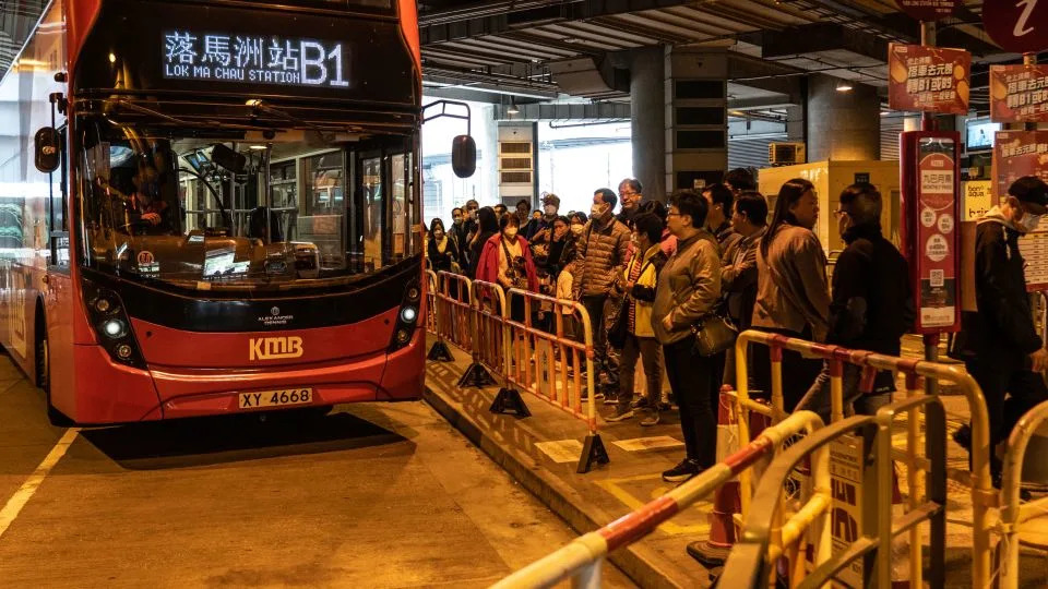People lining up at Yuen Long station in Hong Kong to take cross-border buses to mainland China on January 21, 2024 - Noemi Cassanelli/CNN