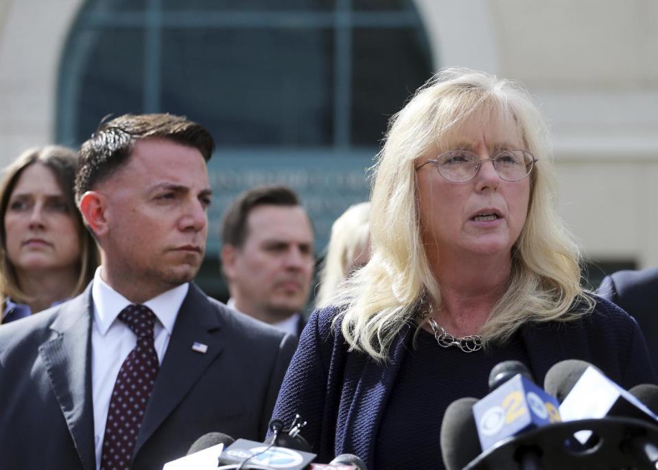 U.S. Attorney Eileen Decker, right, and FBI Special Agent Joshua Stone appear before reporters outside federal court in Riverside, Calif., Thursday, Feb. 16, 2017, after Enrique Marquez Jr. pleaded guilty to providing the high-powered rifles used to kill 14 people in the San Bernardino terror attack. The judge accepted his plea agreement with prosecutors. Under the plea deal, Marquez could face up to 25 years in prison. A sentencing hearing was scheduled for Aug. 21. (AP Photo/Reed Saxon)